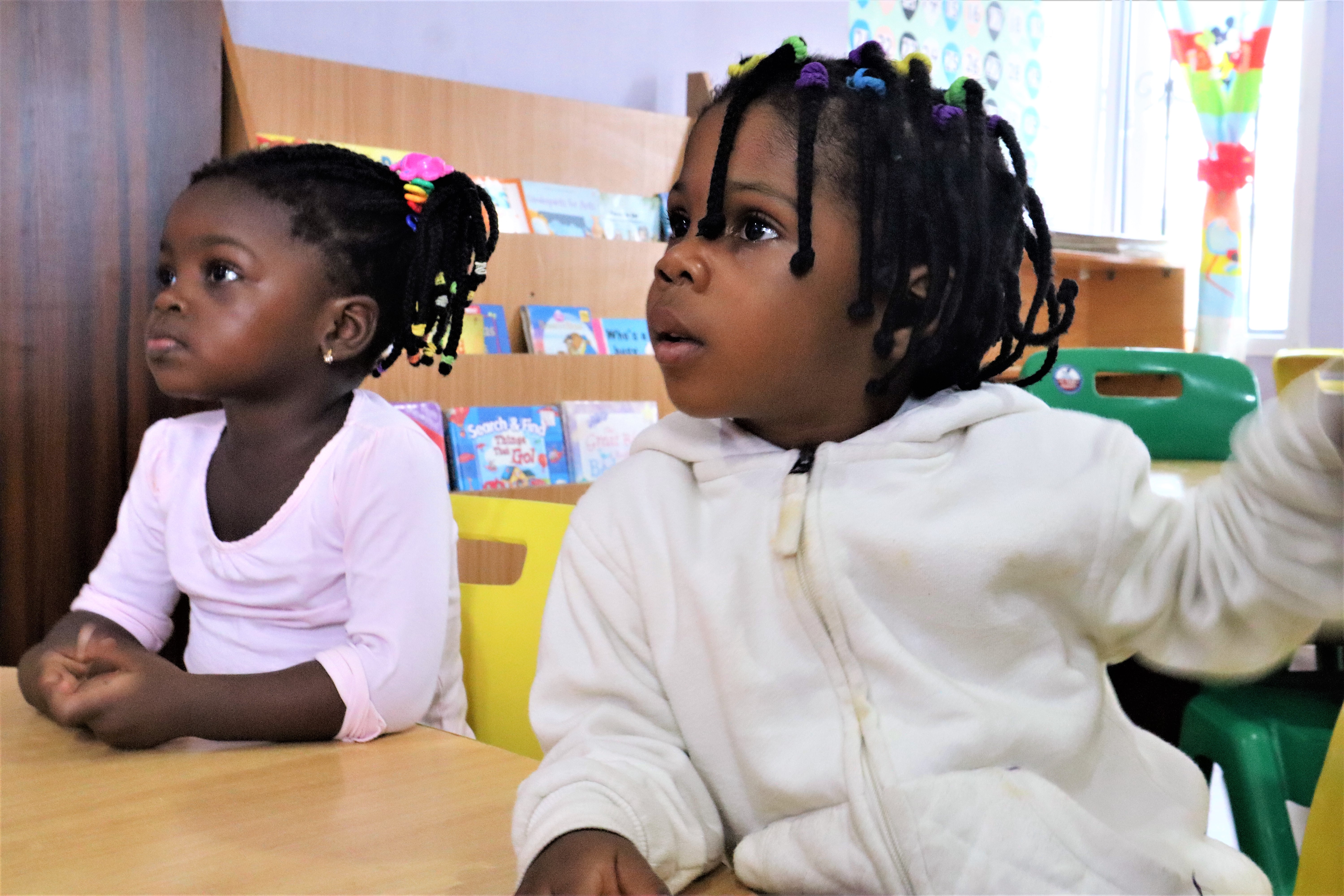 Children engaged in collaborative Montessori activities