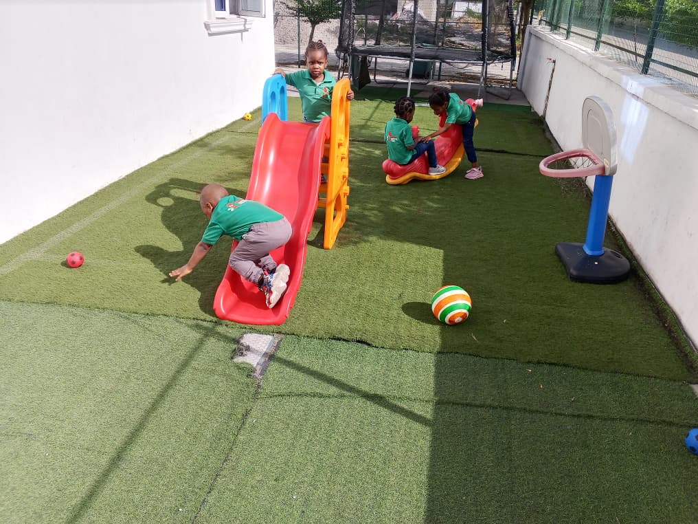 Children engaged in joyful outdoor play at Rosewood Montessori