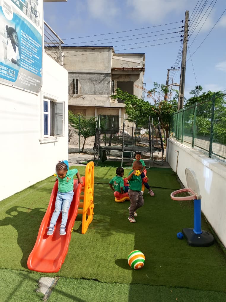 Children playing on outdoor learning equipment