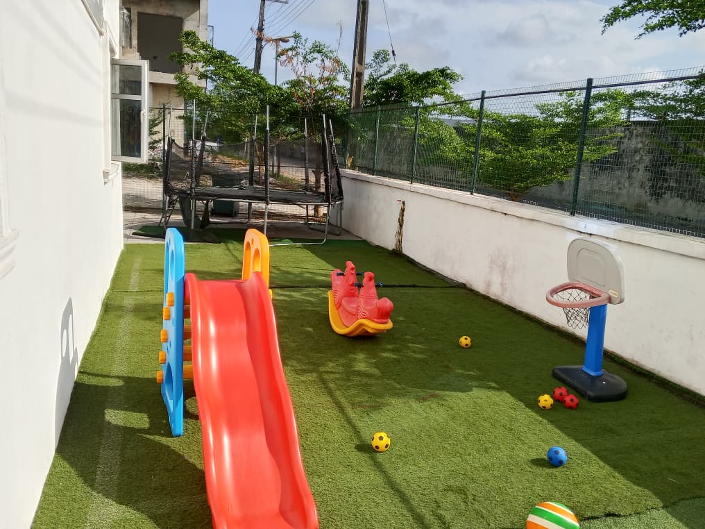 Children playing freely in the open outdoor space