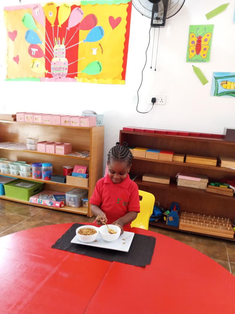 A happy toddler engaged in hands-on learning