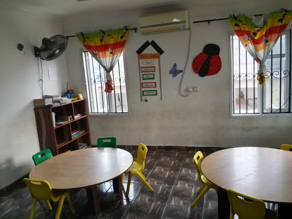 Toddlers working independently at activity tables